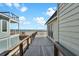Spacious outdoor deck with ocean view, wooden railing, and comfortable seating for relaxation at 1615 E Ashley Ave, Folly Beach, SC 29439