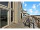 Enjoy the ocean view from the outdoor deck with lounge chairs, sliding door entry, and coastal charm at 1615 E Ashley Ave, Folly Beach, SC 29439