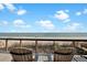 Ocean view from the deck with two Adirondack chairs facing the beach at 1615 E Ashley Ave, Folly Beach, SC 29439