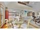 Open-concept dining area with a glass table, wicker chairs, and connecting rooms at 1615 E Ashley Ave, Folly Beach, SC 29439