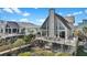 Beautiful two-story home featuring a large deck with seating and scenic views at 1615 E Ashley Ave, Folly Beach, SC 29439