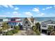Coastal home with double garages and balcony offers picturesque ocean views, blending comfort and seaside charm at 1615 E Ashley Ave, Folly Beach, SC 29439