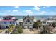Charming beach house featuring double garages, a balcony, and stunning ocean views, perfect for coastal living at 1615 E Ashley Ave, Folly Beach, SC 29439