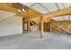 Spacious ground-level garage with concrete floor and unfinished wood columns and ceiling at 1615 E Ashley Ave, Folly Beach, SC 29439