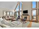 Bright living room with vaulted ceilings, large windows, comfortable seating and ocean views at 1615 E Ashley Ave, Folly Beach, SC 29439