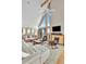 A living room with vaulted ceilings, a ceiling fan, and ocean views at 1615 E Ashley Ave, Folly Beach, SC 29439