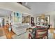 Bright living room with a comfortable sofa, hardwood floors, and neutral decor at 1615 E Ashley Ave, Folly Beach, SC 29439