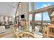 Bright and open living area with large windows, comfortable seating, and ocean views at 1615 E Ashley Ave, Folly Beach, SC 29439