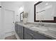 Bathroom with double sinks, granite counters, dark grey cabinets, and modern fixtures at 1738 N N Hwy 52, Bonneau, SC 29431