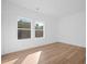 Bright bedroom featuring wood floors, a large double window, and neutral decor at 1738 N N Hwy 52, Bonneau, SC 29431