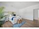 Airy bedroom featuring hardwood floors, a comfortable bed, and ample natural light creating a cozy retreat at 1738 N N Hwy 52, Bonneau, SC 29431