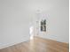 Bright bedroom featuring wood floors, a window for natural light, and neutral decor at 1738 N N Hwy 52, Bonneau, SC 29431
