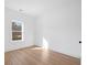 Bright bedroom features wood floors, a window for natural light, and neutral decor at 1738 N N Hwy 52, Bonneau, SC 29431