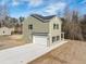 This home features an attached two-car garage, and easy access with a long concrete driveway at 1738 N N Hwy 52, Bonneau, SC 29431