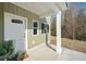 Inviting front entrance with a white door, natural light, and a welcoming porch area at 1738 N N Hwy 52, Bonneau, SC 29431