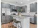 Well-equipped kitchen with stainless steel appliances, a center island, and sleek gray cabinets at 1738 N N Hwy 52, Bonneau, SC 29431