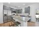 Spacious kitchen featuring gray cabinets, stainless steel appliances, and a functional island with seating at 1738 N N Hwy 52, Bonneau, SC 29431