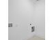 Clean laundry room featuring gray tiled floors and connections for a washer and dryer at 1738 N N Hwy 52, Bonneau, SC 29431
