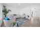 Bright living room featuring stylish decor, hardwood floors, and ample natural light, perfect for entertaining at 1738 N N Hwy 52, Bonneau, SC 29431