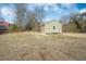Backyard shed situated on a large lot with mature trees at 1738 N N Hwy 52, Bonneau, SC 29431