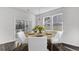 Bright dining area featuring a round wood table with white chairs and natural light at 187 Belfort Place, Summerville, SC 29486