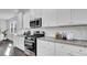 Bright kitchen features granite countertops, stainless steel appliances, and white subway tile backsplash at 187 Belfort Place, Summerville, SC 29486