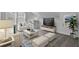 Comfortable living room with plush seating, a large television, and ample natural light at 187 Belfort Place, Summerville, SC 29486