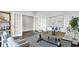 Inviting home office boasts French doors, neutral colors, and a large window overlooking the outdoors at 187 Belfort Place, Summerville, SC 29486