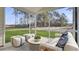 Relaxing porch offers a serene view with comfortable seating at 187 Belfort Place, Summerville, SC 29486