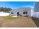 Backyard with a patio and a white fence, offering a private outdoor area for leisure and entertaining at 202 Tall Grass Ct, Summerville, SC 29483