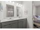 Bathroom with double vanity, quartz countertops, and ample storage space at 202 Tall Grass Ct, Summerville, SC 29483