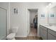 Bathroom featuring a glass-enclosed shower and an adjacent walk-in closet for optimal convenience at 202 Tall Grass Ct, Summerville, SC 29483