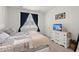 Serene bedroom featuring soft carpet, white walls, and a large window offering natural light at 202 Tall Grass Ct, Summerville, SC 29483