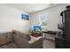 Cozy bedroom with a comfortable couch and an organized workspace for relaxation and productivity at 202 Tall Grass Ct, Summerville, SC 29483