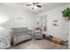 Bedroom room featuring soft carpet, a crib, and a neutral color scheme at 202 Tall Grass Ct, Summerville, SC 29483