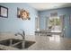 Dining area boasts a bright window and modern finishes, perfect for entertaining at 202 Tall Grass Ct, Summerville, SC 29483