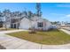 Well-maintained single-Gathering home featuring a spacious front lawn and attached two-car garage at 202 Tall Grass Ct, Summerville, SC 29483
