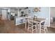Open floor plan with a dining space featuring a wooden table at 202 Tall Grass Ct, Summerville, SC 29483