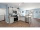 Modern kitchen featuring stainless steel appliances, gray cabinets, and an eat-in island at 202 Tall Grass Ct, Summerville, SC 29483