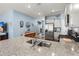 Open kitchen features granite counters, stainless steel appliances, and ample cabinet space at 202 Tall Grass Ct, Summerville, SC 29483
