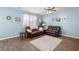 Inviting living room with comfortable seating, a ceiling fan, and stylish decor at 202 Tall Grass Ct, Summerville, SC 29483
