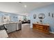 Spacious open concept living area featuring wood floors, modern decor, and ample seating at 202 Tall Grass Ct, Summerville, SC 29483