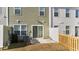 Backyard with concrete patio, grass, wooden fence, and the back of the house at 204 Cozy Brook Ct, Summerville, SC 29486