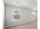 Bright bedroom with natural light, carpeted flooring, and neutral-colored walls providing a cozy atmosphere at 204 Cozy Brook Ct, Summerville, SC 29486