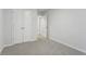 Bedroom with white walls, carpet flooring and an open doorway to the rest of the home at 204 Cozy Brook Ct, Summerville, SC 29486