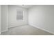 Cozy bedroom with natural light, neutral walls, and carpeted flooring for a comfortable living space at 204 Cozy Brook Ct, Summerville, SC 29486