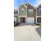 Charming townhouse featuring varied siding, a one-car garage, and a concrete driveway at 204 Cozy Brook Ct, Summerville, SC 29486