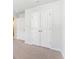Hallway with neutral carpet and white doors leading to other rooms at 204 Cozy Brook Ct, Summerville, SC 29486