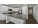 Stylish kitchen with a stainless steel fridge, white cabinets, and an island at 204 Cozy Brook Ct, Summerville, SC 29486