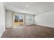 Spacious room featuring vinyl wood flooring and sliding glass doors for natural light at 204 Cozy Brook Ct, Summerville, SC 29486
